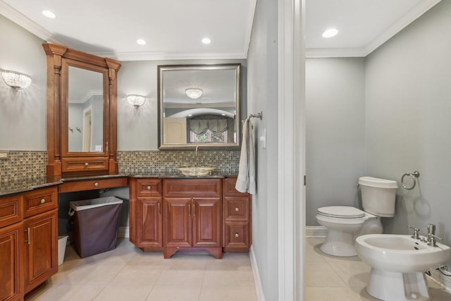 bathroom with toilet, tasteful backsplash, a bidet, and ornamental molding