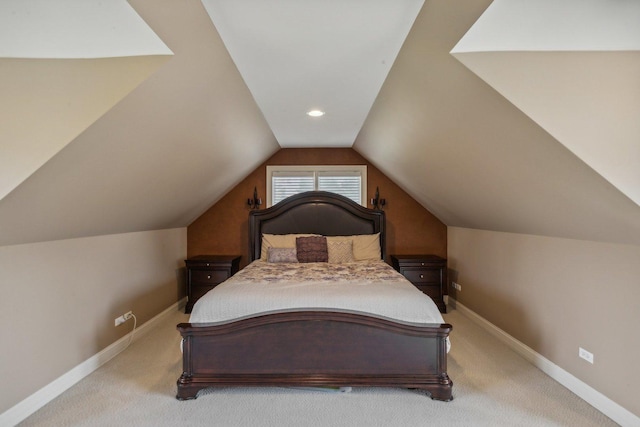 bedroom with carpet, vaulted ceiling, and baseboards