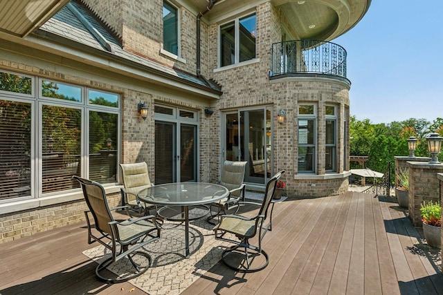 deck with outdoor dining area