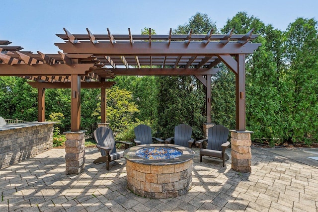 view of patio / terrace featuring an outdoor fire pit and a pergola