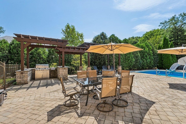 view of patio featuring a fenced in pool, outdoor dining area, area for grilling, a pergola, and exterior kitchen