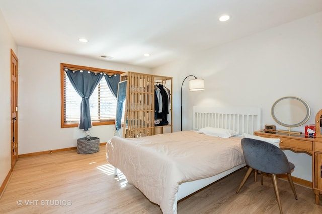 bedroom featuring visible vents, recessed lighting, baseboards, and light wood-type flooring