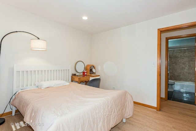 bedroom featuring recessed lighting, baseboards, and wood finished floors