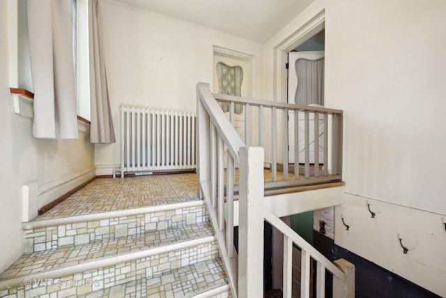 staircase with radiator