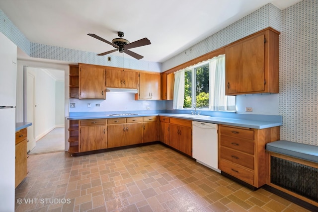 kitchen featuring white appliances, wallpapered walls, open shelves, light countertops, and brick patterned floor