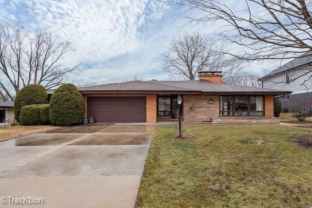 view of front of house with an attached garage, brick siding, concrete driveway, a front lawn, and a chimney