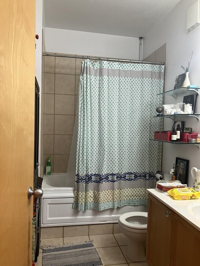 bathroom with a wall unit AC, toilet, tile patterned flooring, shower / bathtub combination with curtain, and vanity