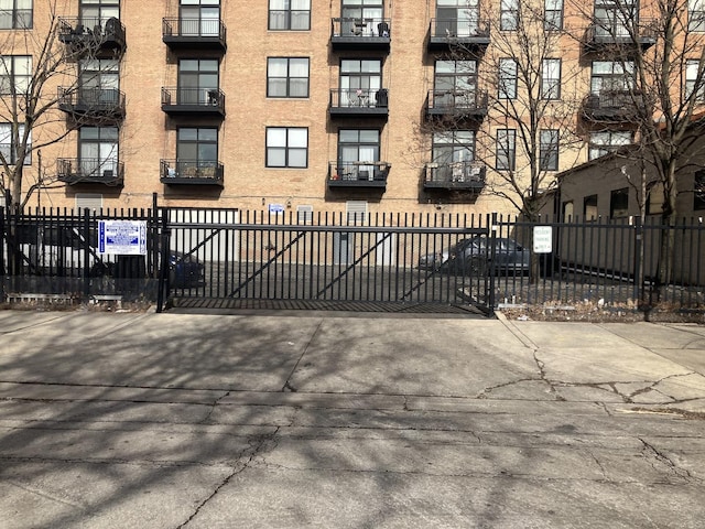 view of gate with fence