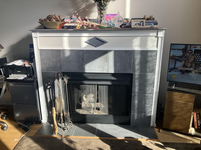 room details featuring a tiled fireplace