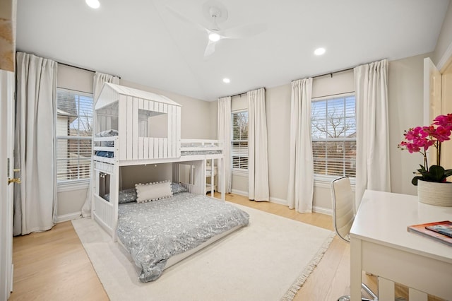 bedroom with ceiling fan, baseboards, vaulted ceiling, recessed lighting, and wood finished floors