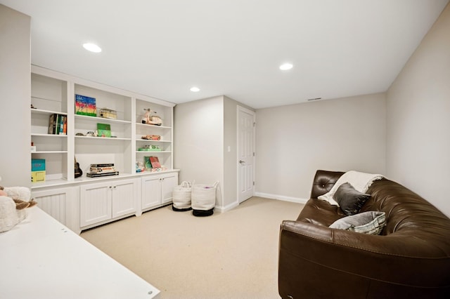 sitting room with visible vents, recessed lighting, light colored carpet, and baseboards