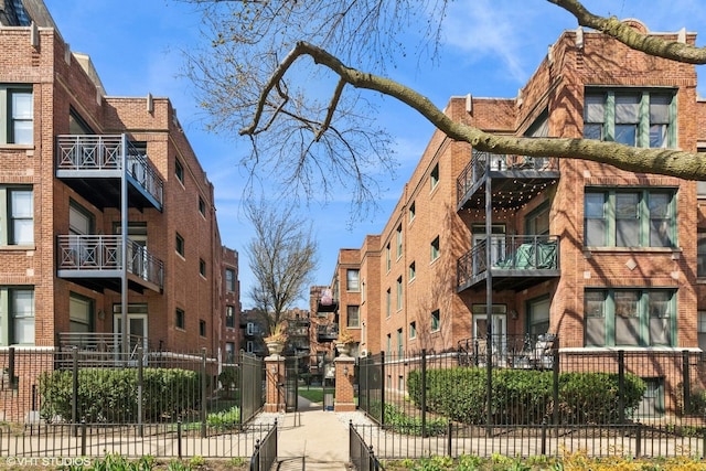 view of building exterior with a fenced front yard
