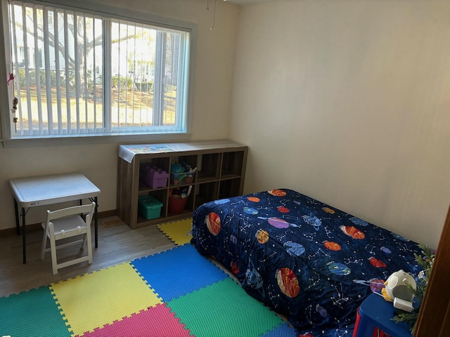 bedroom with wood finished floors