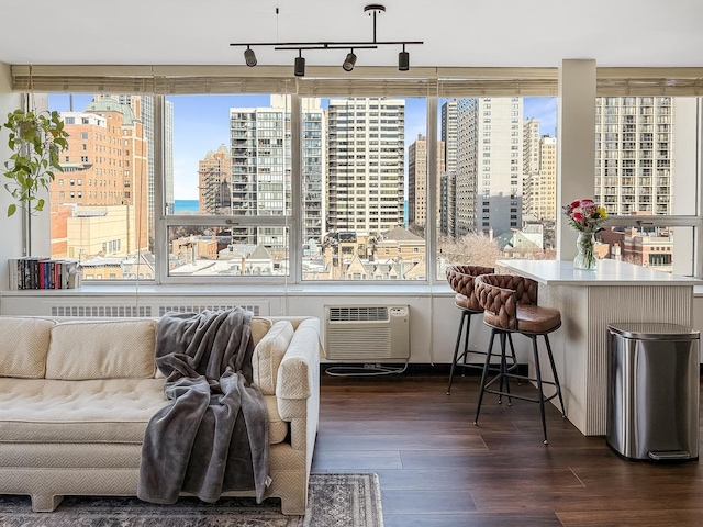 sunroom / solarium with a view of city and a wall mounted AC