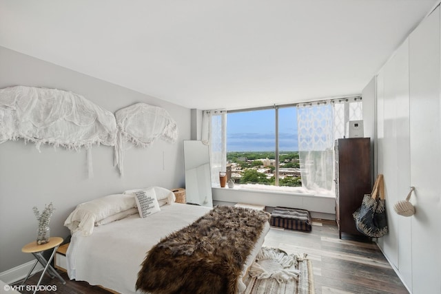 bedroom with wood finished floors