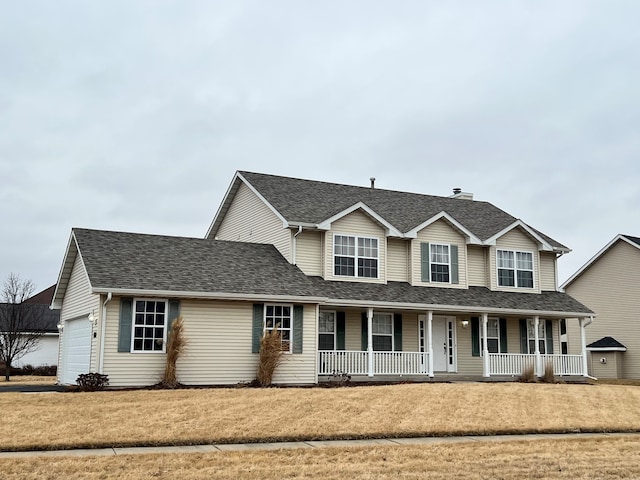 view of front of home featuring a garage, covered porch, and roof with shingles