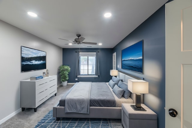 bedroom featuring light carpet, ceiling fan, recessed lighting, and baseboards