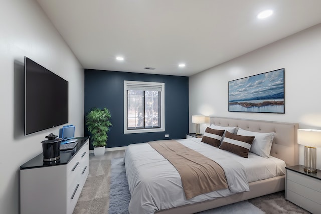 bedroom with light carpet, baseboards, visible vents, and recessed lighting