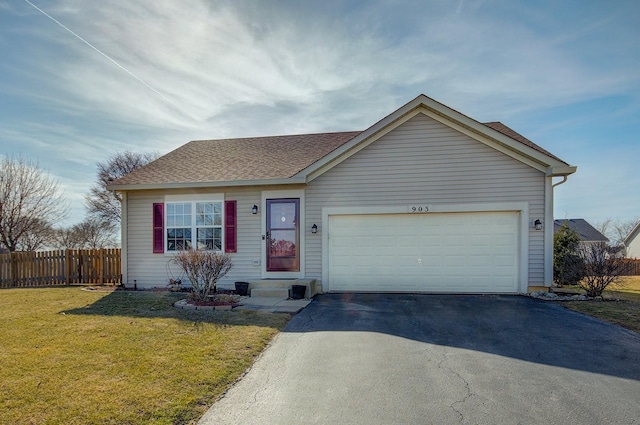 ranch-style home with a shingled roof, fence, a front yard, a garage, and driveway