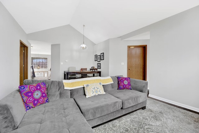 living room with lofted ceiling, a notable chandelier, and baseboards