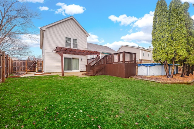 back of house featuring a fenced in pool, a fenced backyard, a yard, and a pergola