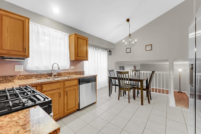 kitchen featuring a notable chandelier, stainless steel appliances, a sink, and light tile patterned flooring