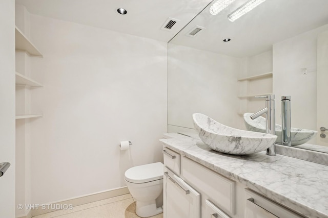 bathroom featuring recessed lighting, visible vents, toilet, and vanity