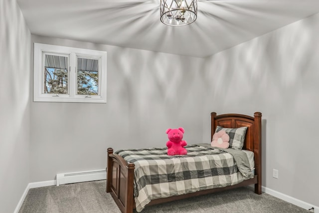 carpeted bedroom with baseboards, a notable chandelier, and baseboard heating