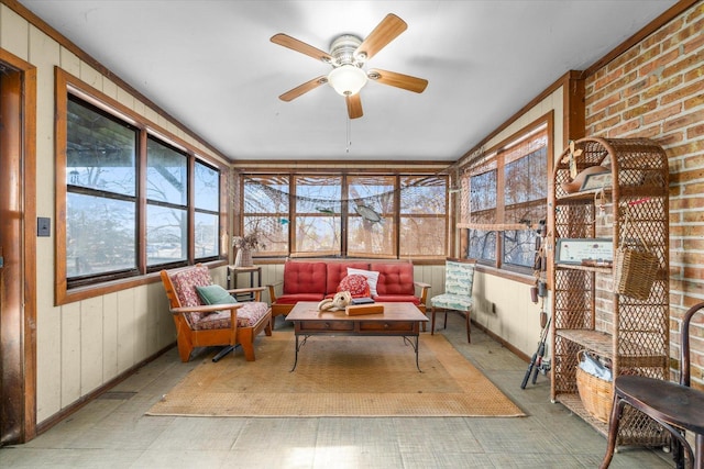 sunroom with a ceiling fan