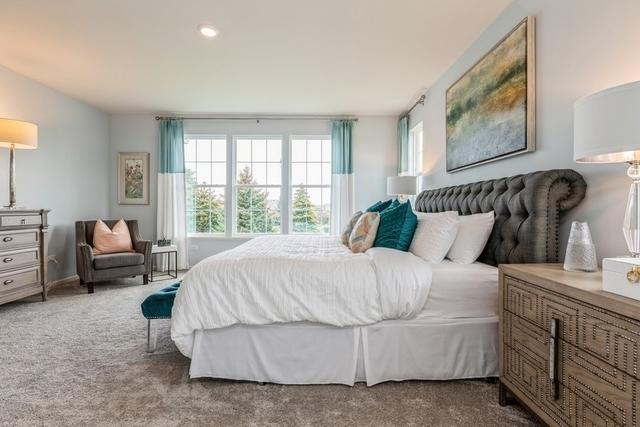 carpeted bedroom featuring recessed lighting