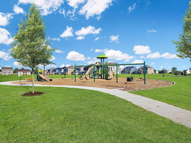 community play area with a residential view and a lawn