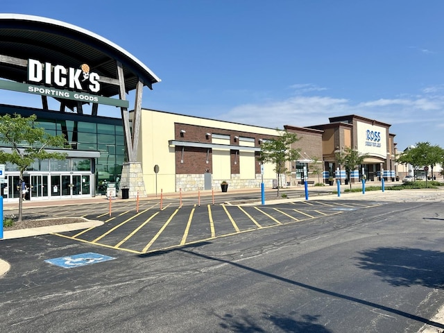 view of property featuring uncovered parking