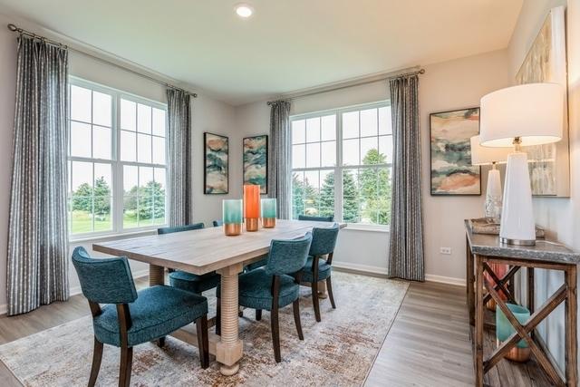 dining room with light wood-style flooring and baseboards