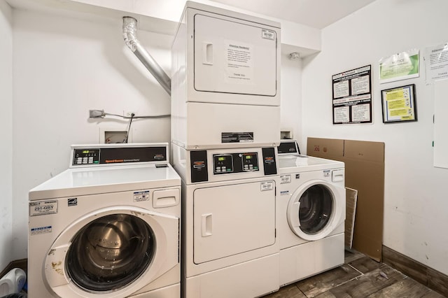 shared laundry area with baseboards, washing machine and clothes dryer, dark wood finished floors, and stacked washer / drying machine