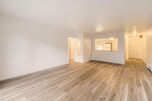 spare room featuring light wood finished floors