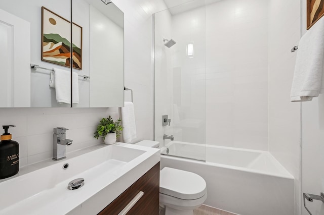 full bathroom with toilet, vanity, backsplash, and shower / bathing tub combination