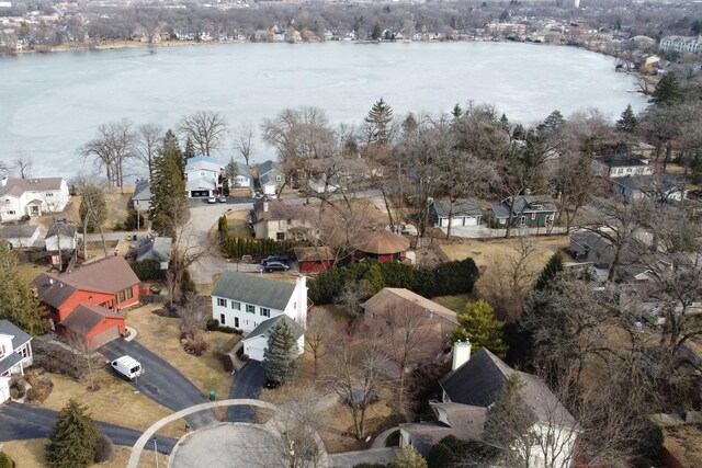 birds eye view of property with a residential view and a water view