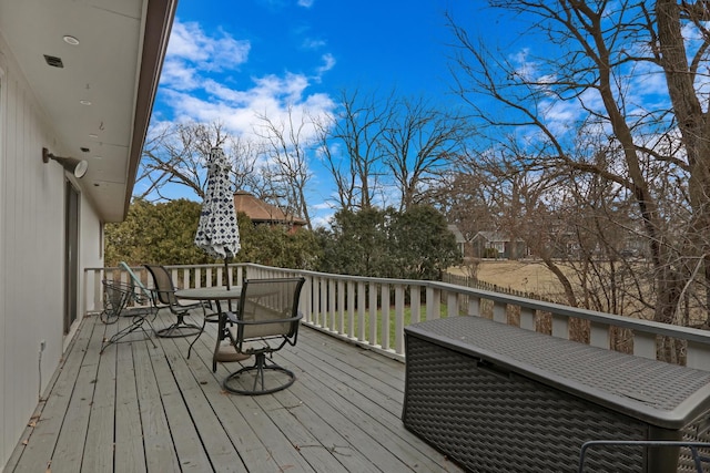 wooden terrace featuring outdoor dining space