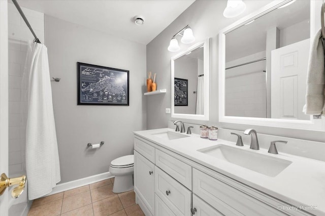 full bathroom with a shower with curtain, a sink, and tile patterned floors