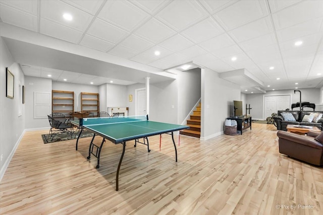 game room featuring recessed lighting, baseboards, and light wood finished floors