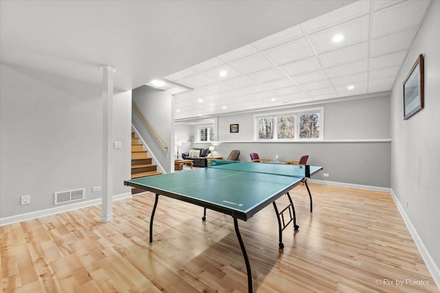 recreation room with recessed lighting, wood finished floors, visible vents, and baseboards