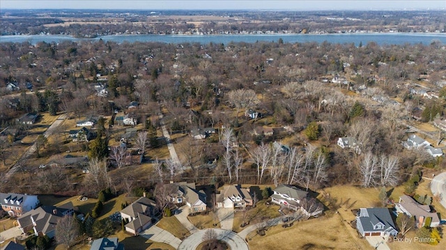 drone / aerial view featuring a water view and a residential view