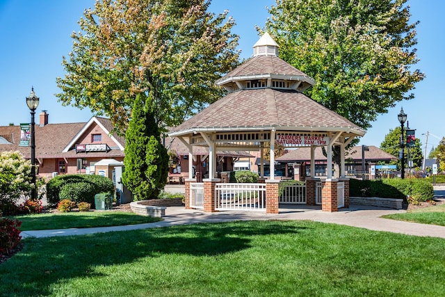 view of property's community featuring a lawn and a gazebo