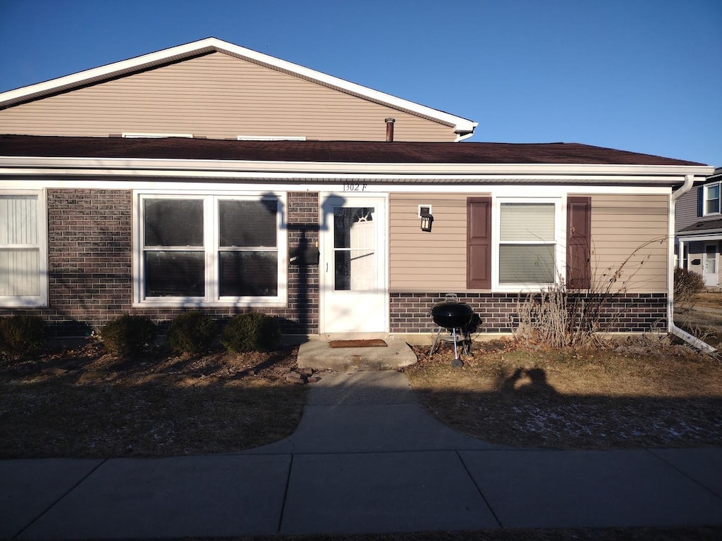 view of front of home featuring brick siding