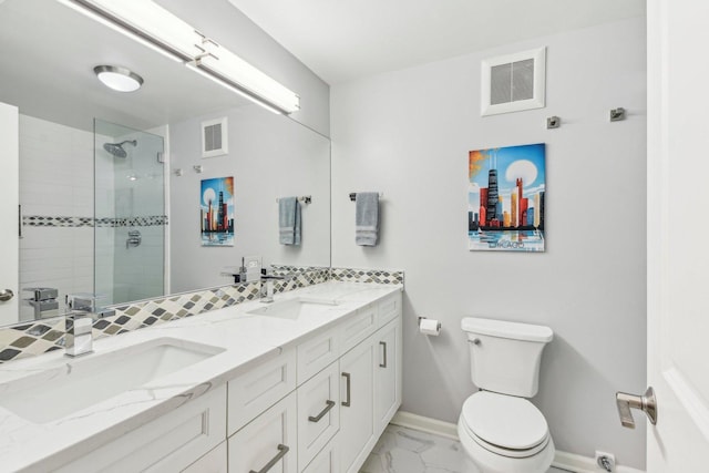 bathroom with marble finish floor, a stall shower, a sink, and visible vents