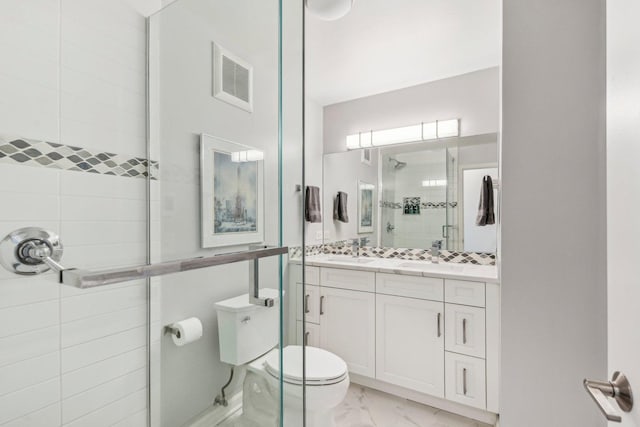 full bathroom featuring visible vents, toilet, marble finish floor, vanity, and a shower stall