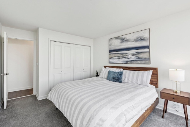 bedroom featuring a closet, carpet flooring, and baseboards