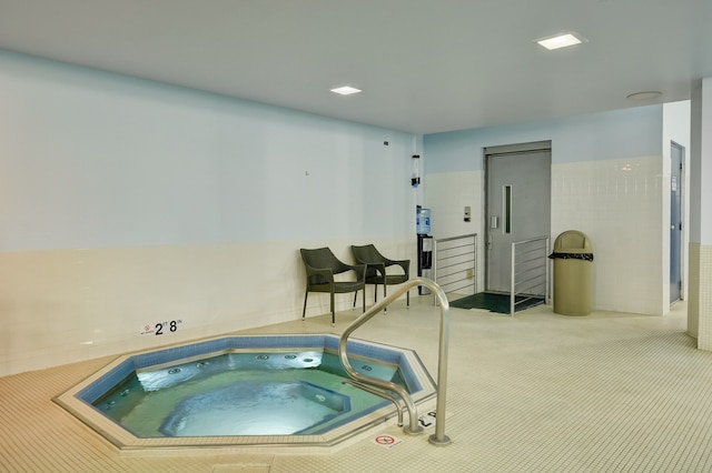 view of pool with an indoor in ground hot tub