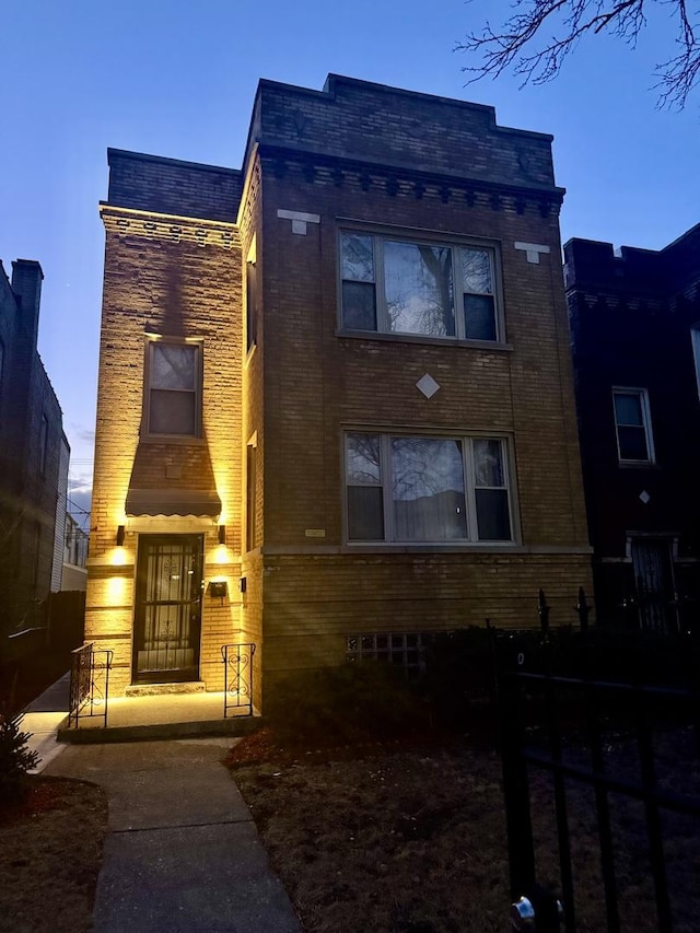 view of property featuring brick siding