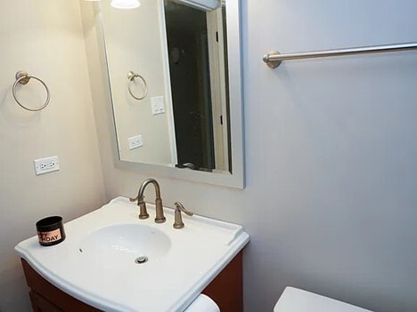 bathroom with vanity and toilet